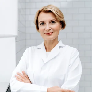Experienced general dentist near me in Newark standing confidently in a modern dental clinic